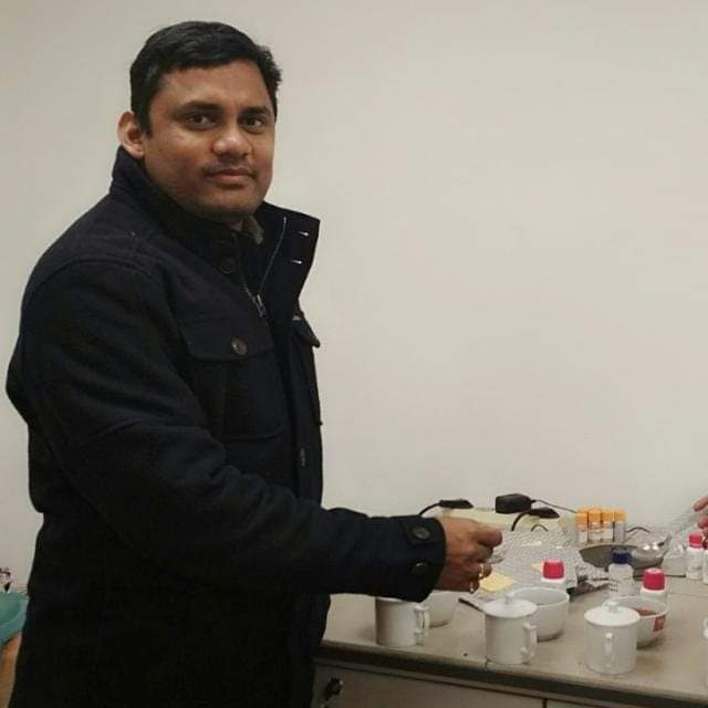 Tea taster preparing samples at the tasting bench